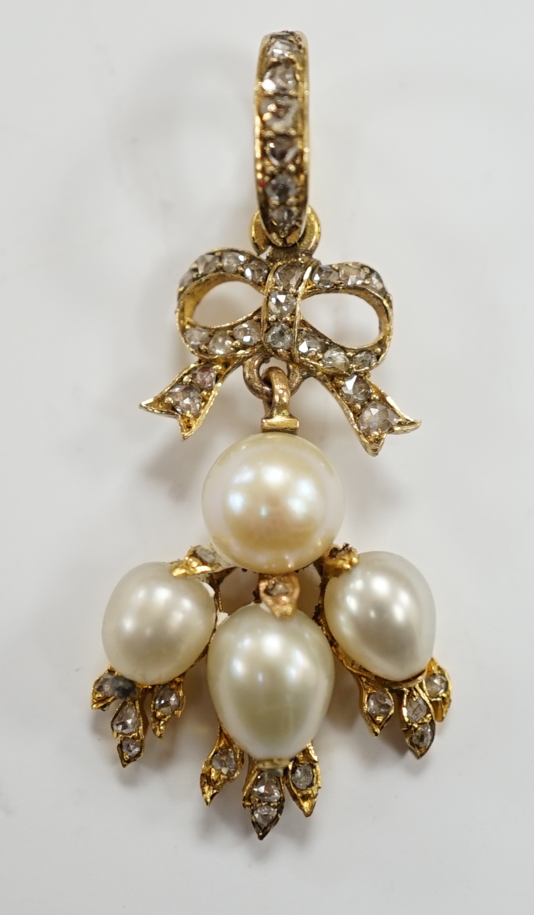 A yellow metal, cultured pearl and rose cut diamond cluster set drop pendant, 34mm, gross weight 3.4 grams.